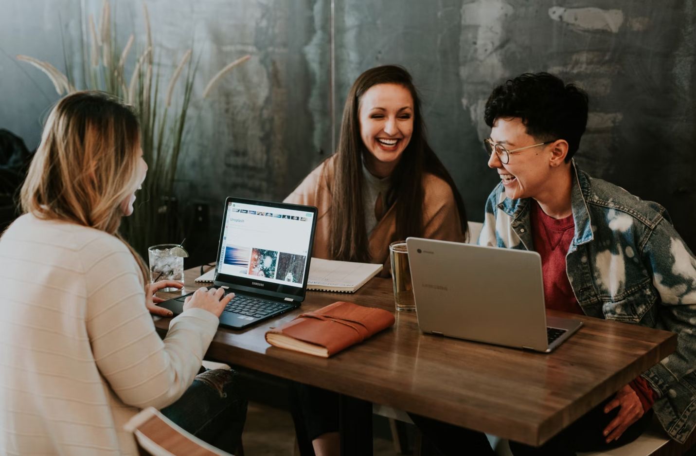 Photo of colleagues working together and laughing