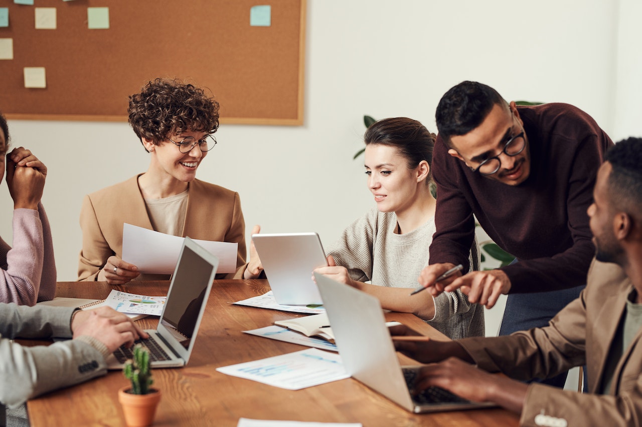 A photo of a group of professionals working together.