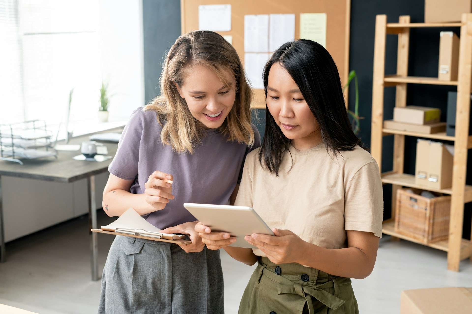 A photo of a manager and employee reviewing data together.