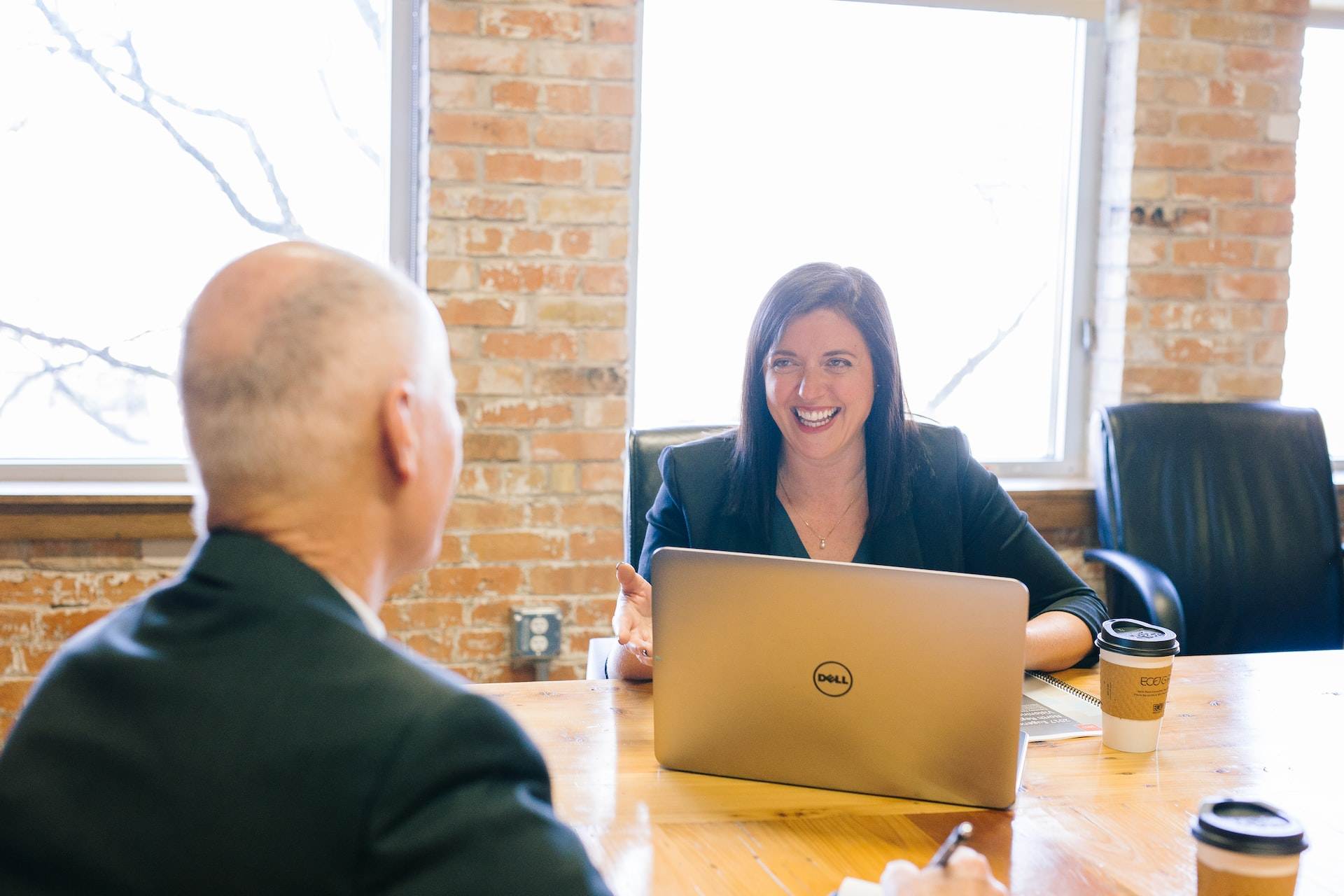 A photo of a manager interviewing an employee.